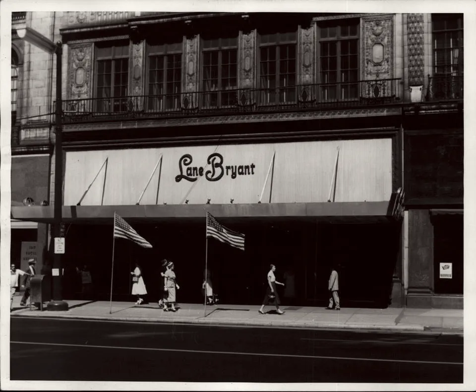 A Lane Bryant storefront with its script signage and awnings.